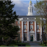 Harvard Business School campus buildings and greenery in Cambridge, Massachusetts.