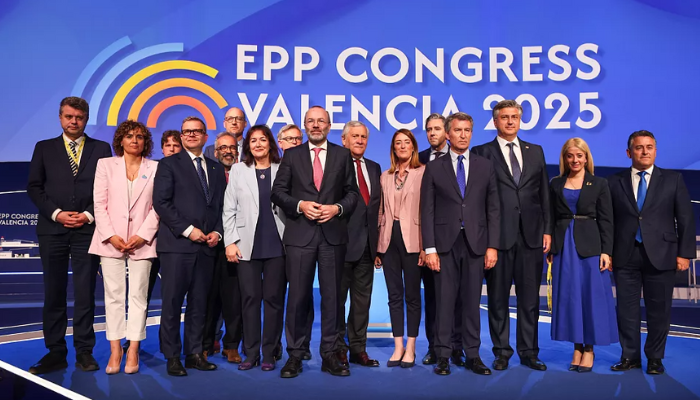 Group of EPP leaders and delegates standing on stage at the EPP Congress in Valencia 2025.