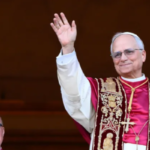 Newly elected Pope Leo XIV, Cardinal Robert Francis Prevost, waves to the crowd from the central loggia of St. Peter's Basilica in Vatican City, after his election as the new pope.