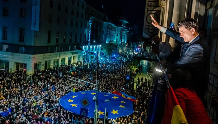 Nicușor Dan celebrates his presidential victory with supporters in Bucharest, Romania, on May 18, 2025.