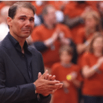 Rafael Nadal delivers a heartfelt farewell speech at Roland Garros, surrounded by fans and fellow tennis legends, celebrating his remarkable legacy in tennis.
