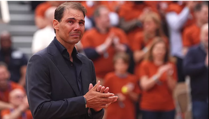 Rafael Nadal delivers a heartfelt farewell speech at Roland Garros, surrounded by fans and fellow tennis legends, celebrating his remarkable legacy in tennis.