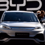 People inspecting BYD's ATTO 3 EV at an auto exhibition in Munich, Germany