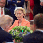 President of Ukraine in official office setting with national flag, symbolizing leadership and governance