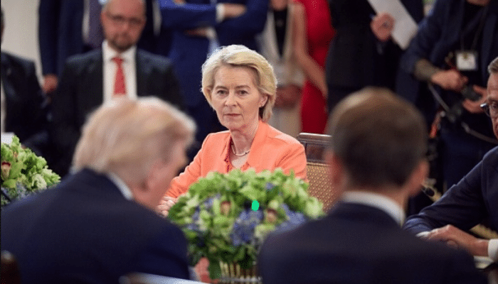 President of Ukraine in official office setting with national flag, symbolizing leadership and governance