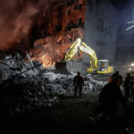 Dark street in Dnipropetrovsk during blackout caused by Russian drone strikes on critical energy infrastructure.