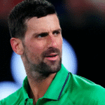 Novak Djokovic celebrates after winning his 100th career match at the Australian Open in Melbourne.