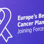 A healthcare professional consulting a patient in a European cancer treatment centre, representing advances in cancer prevention, early detection, and patient care.